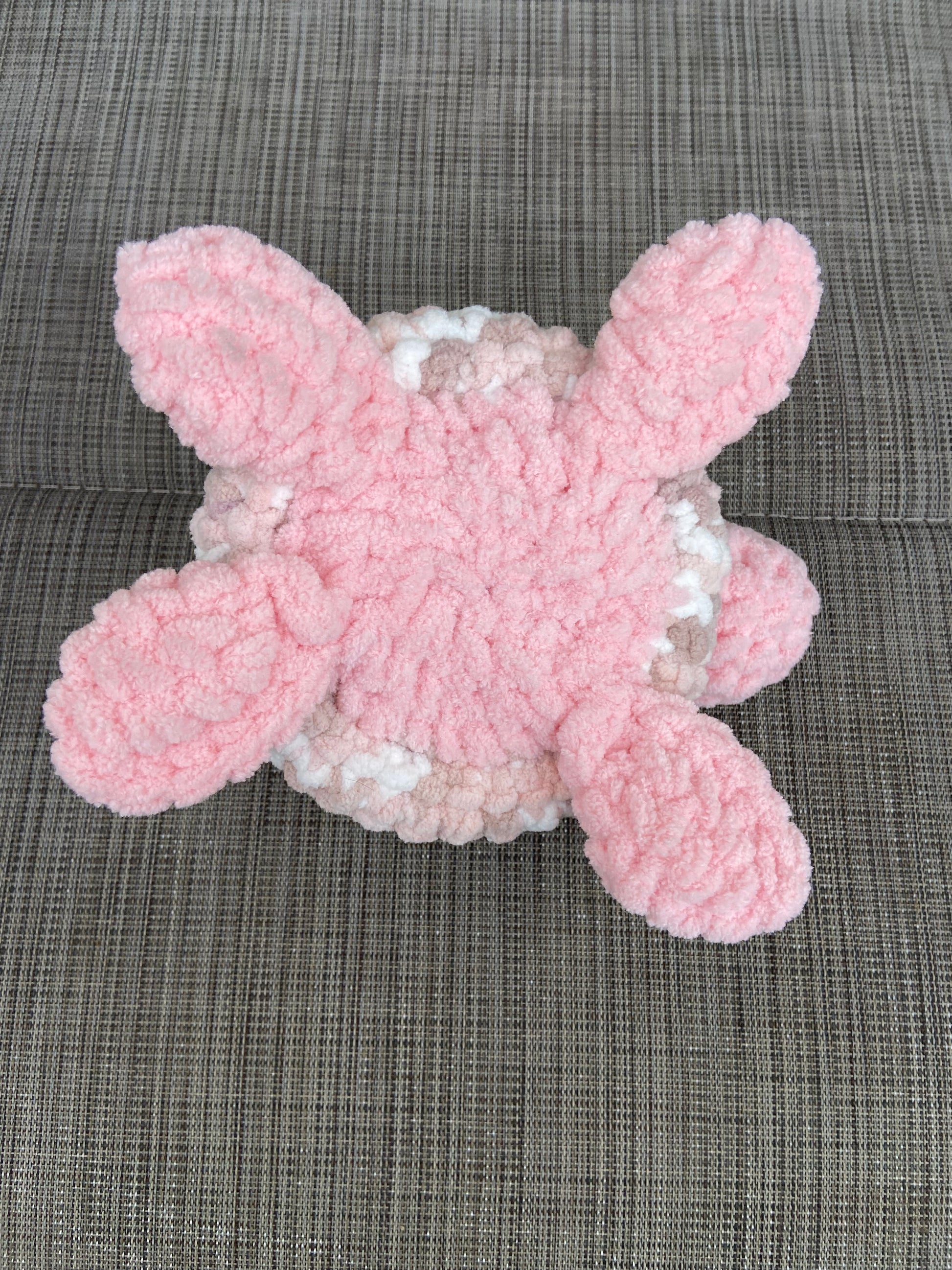 Close-up of crocheted baby turtle